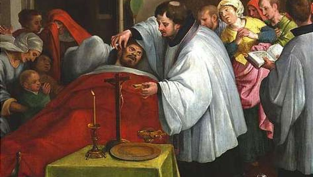 Le sacrement d'extrême-onction administré par un prêtre catholique traditionnel